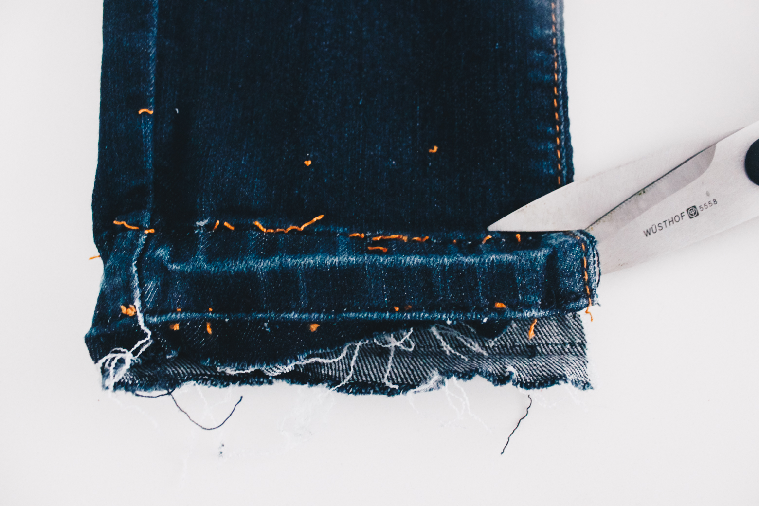 how to distress the hem on your jeans pic